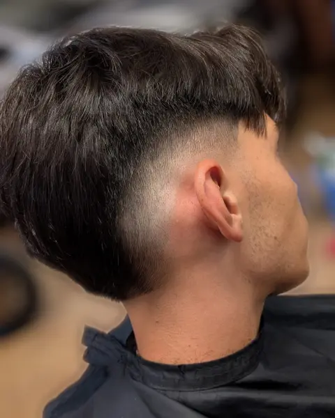 Low taper con frangia scalata – taglio uomo StreetBarber